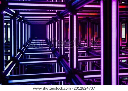 Futuristic purple, violet neon light cube art installation. Technology cyber cube, Sci fi shape.