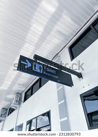 Low angle view of Restroom sign on airport