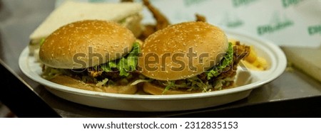 Fresh tasty burger on dark background. selective focus