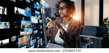 Mixed media of black woman working in office and visual screens concept. NFT. Non-fungible token. Image generation AI. Royalty-Free Stock Photo #2312841719