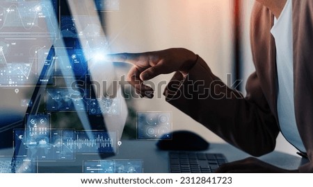 Black woman working in office and digital technology concept. ICT (Information Communication Technology). System engineering. GUI (Graphical User Interface). Royalty-Free Stock Photo #2312841723
