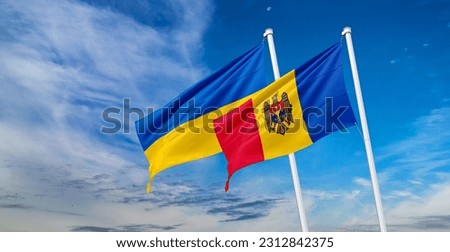 Flags of moldova and ukraine on flagpoles 