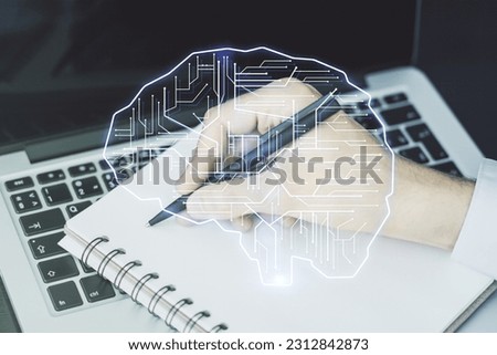Creative artificial Intelligence concept with human brain sketch and hand writing in diary on background with laptop. Double exposure Royalty-Free Stock Photo #2312842873
