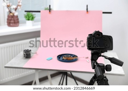 Professional equipment and composition with delicious dessert on pink background in studio. Food photography