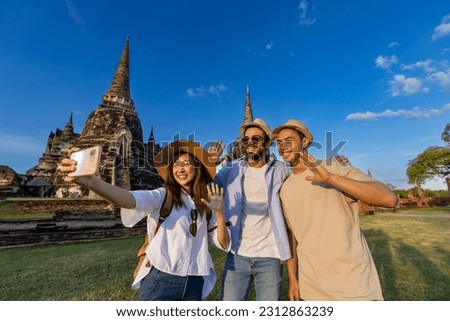 Tourists take selfie photo at Wat Phra Si Sanphet temple, Ayutthaya Thailand, for travel, vacation, holiday, honeymoon and tourism Royalty-Free Stock Photo #2312863239