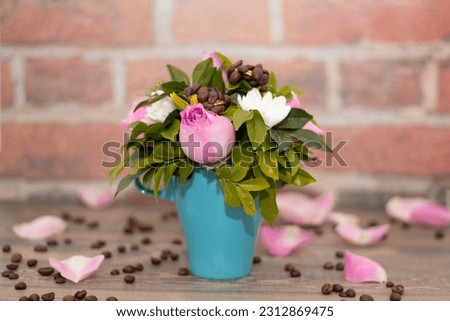 Blue healthy coffee cup with flowers on the table. Beautiful decoration.