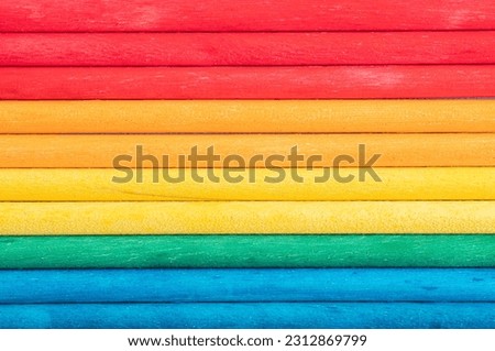 Background from multicolored boards in colors of rainbow. Background texture of colorful wooden planks	
