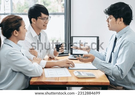 Asian couple drinking coffee cup and meeting with financial advisor to consultation about investment of new business while he is analysis about investment and giving advice to client
