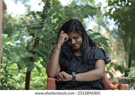 indian student looking time, waiting someone