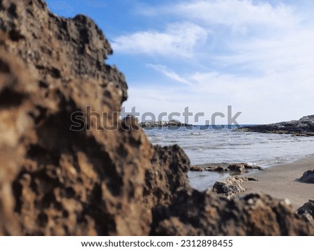 A photo of the true sea and sky taken between the rocks