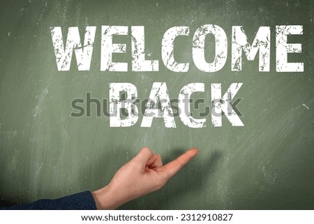 Welcome back. Text on a green chalk board.