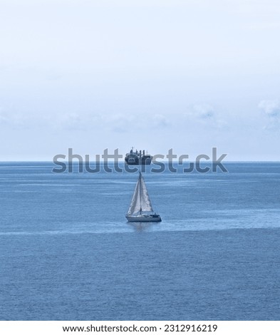 graphic seascape picture of 2 boats aligned in the ocean