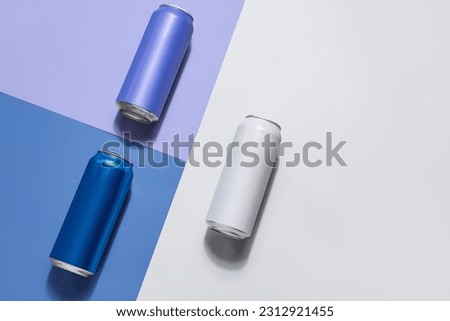 Cans of fresh soda on color background