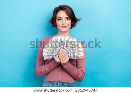 Photo of gorgeous positive person hands hold dollar banknotes bills isolated on blue color background