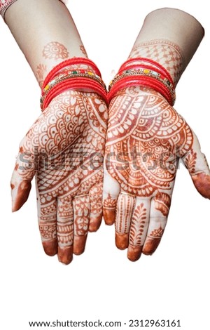 Beautiful woman dressed up as Indian tradition with henna mehndi design on her both hands to celebrate big festival of Karwa Chauth with plain white background Royalty-Free Stock Photo #2312963161