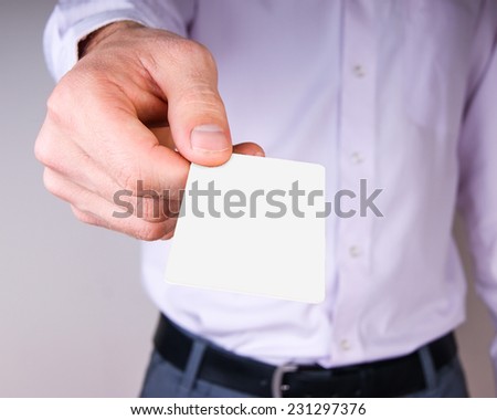 white card in a man's hand