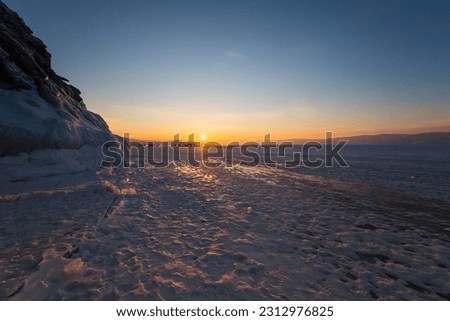 Coast of lake Baikal in winter, the deepest and largest freshwater lake by volume in the world, located in southern Siberia, Russia Royalty-Free Stock Photo #2312976825