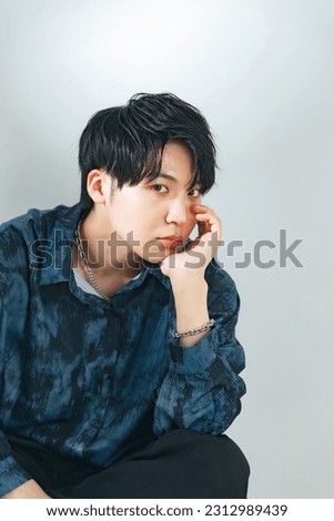 Fashion portrait of Asian boy. Genderless makeup. Korean makeup. Men's cosmetics.