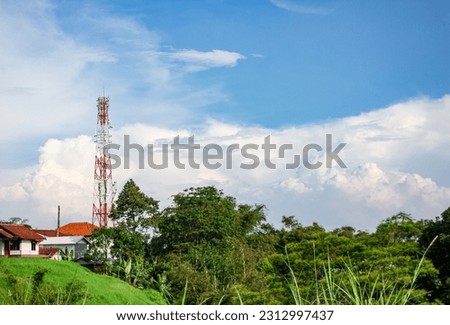 aerial view Cell phone communication antenna tower with rural countryside landscape, Cell site and Telecom Base Station Royalty-Free Stock Photo #2312997437