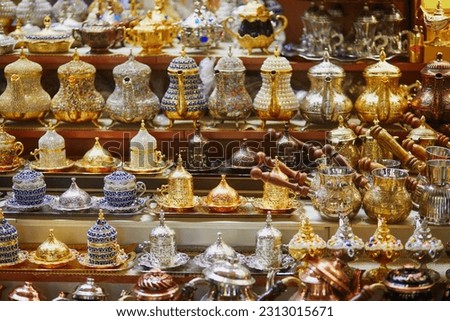 Beautiful tea and coffee sets on Egyptian Bazaar or Spice Bazaar, one of the largest bazaars in Istanbul, Turkey. Market sells spices, sweets, jewellery, dried fruits and nuts