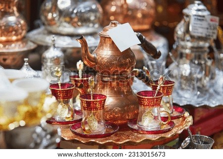 Beautiful tea set on Egyptian Bazaar or Spice Bazaar, one of the largest bazaars in Istanbul, Turkey. Market sells spices, sweets, jewellery, dried fruits and nuts