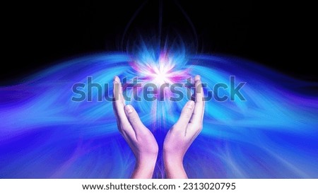 Aura phenomena. Woman with flows of energy making beautiful pattern between her hands against black background, closeup Royalty-Free Stock Photo #2313020795
