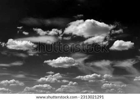Real clouds and sky hi-res texture for design and retouch - abstract photo texture of the real clouds on the black background for adding and editing as a background layer in the Screen blending mode Royalty-Free Stock Photo #2313021291