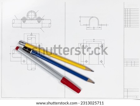 Top view of pen and pencils on blueprint. Construction background. Engineering tools. Copy space