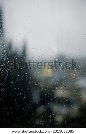 watching the rain through the window