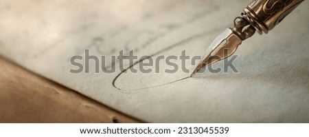 Fountain pen on an antique handwritten letter. Vintage nib pen and handwritten english cursive style font copperplate, spencerian. Old history background. Retro style. Royalty-Free Stock Photo #2313045539