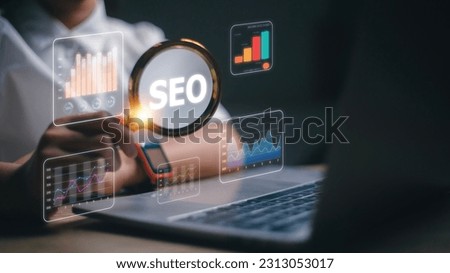 Women use magnifying glasses and computers for analysis of SEO, and search engine optimization ranking traffic websites. internet business technology for promoting traffic to the website. Royalty-Free Stock Photo #2313053017