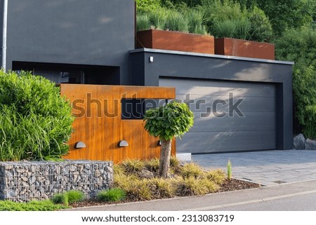 garage carport on a modern house facade in south germany city at summer sunshine and blue sky Royalty-Free Stock Photo #2313083719