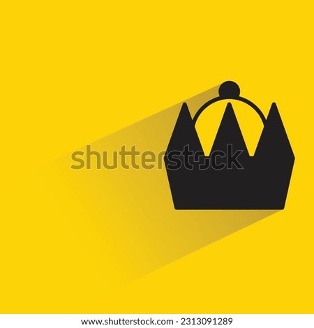 king crown with shadow on yellow background