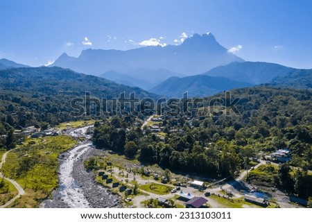 Aerial view of melangkap river and mount kinabalu on background Royalty-Free Stock Photo #2313103011