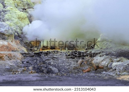 Extracting sulphur inside Kawah Ijen crater. The world's largest acidic lake, inside the crater of Kawah Ijen volcano in East Java, Indonesia.