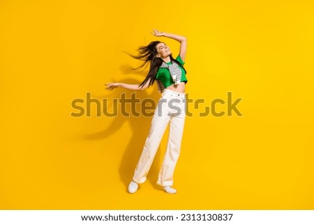 Full body photo of carefree excited nice lady enjoy dancing outfit clothes ad isolated on yellow color background