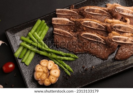 Grilled Beef Ribs, BBQ Beef
Food photography on a black background