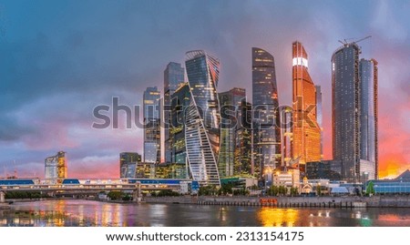 High buildings of Moscow-City at Moskva River at summer sunset, Russia. Moscow-City is business district in Moscow. Panorama of modern office buildings at summer sumset, Moscow downtown in summer. Royalty-Free Stock Photo #2313154175