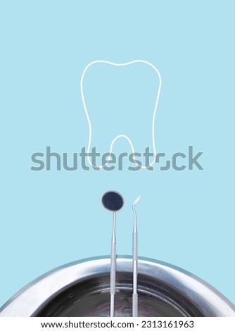 Different tools for dental care in woman hand with thin linear tooth outline icon. Tooth symbol sign.. Dental background. With copy space, close-up. Oral dental hygiene concept