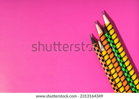 Top view of pencils on the magenta background.Concept of creativity and imagination