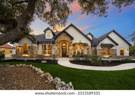 An American home at sunset  Royalty-Free Stock Photo #2313189101