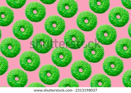 green donuts on light pink background big size. High quality photo