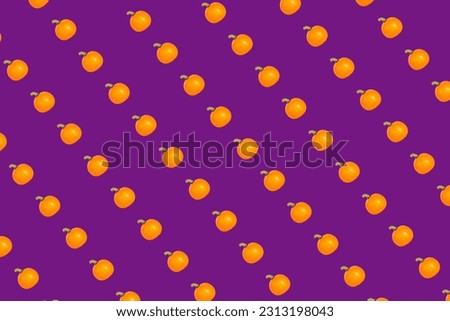 orange pumpkin print top view on purple background. High quality photo