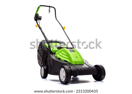 Garden electric lawn mower with a grass collector isolated on white background Royalty-Free Stock Photo #2313200435