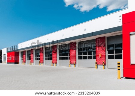 new fire station with parked cars  Royalty-Free Stock Photo #2313204039