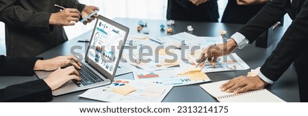 Analyst team use sticky note for creative and analytic brainstorm for business idea with BI data dashboard on laptop screen. Analysis financial data visualization tech for marketing strategy. Prodigy