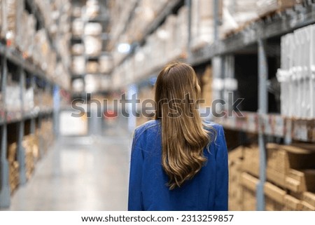 Portrait engineer asian woman shipping order detail check goods and supplies on shelves with goods background inventory in factory warehouse.logistic industry and business import export