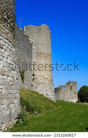 Low-angle view of the walls of the medieval castle of Yèvre le Châtel and its four round corner towers in the department of Loiret, France