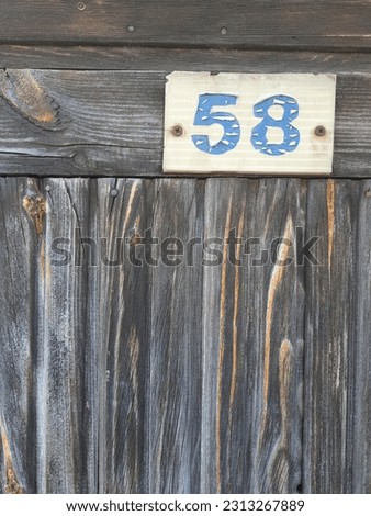 The wooden door with the number 58.