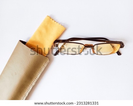 Brown glasses and covers on a white background. Vintage glasses. From above.